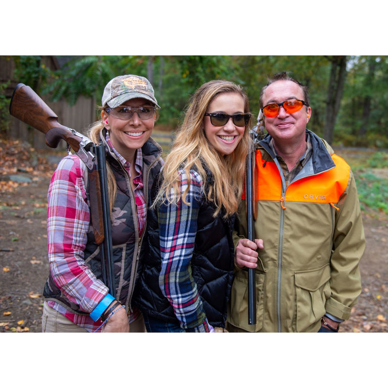 A group of hunters posing for the camera.